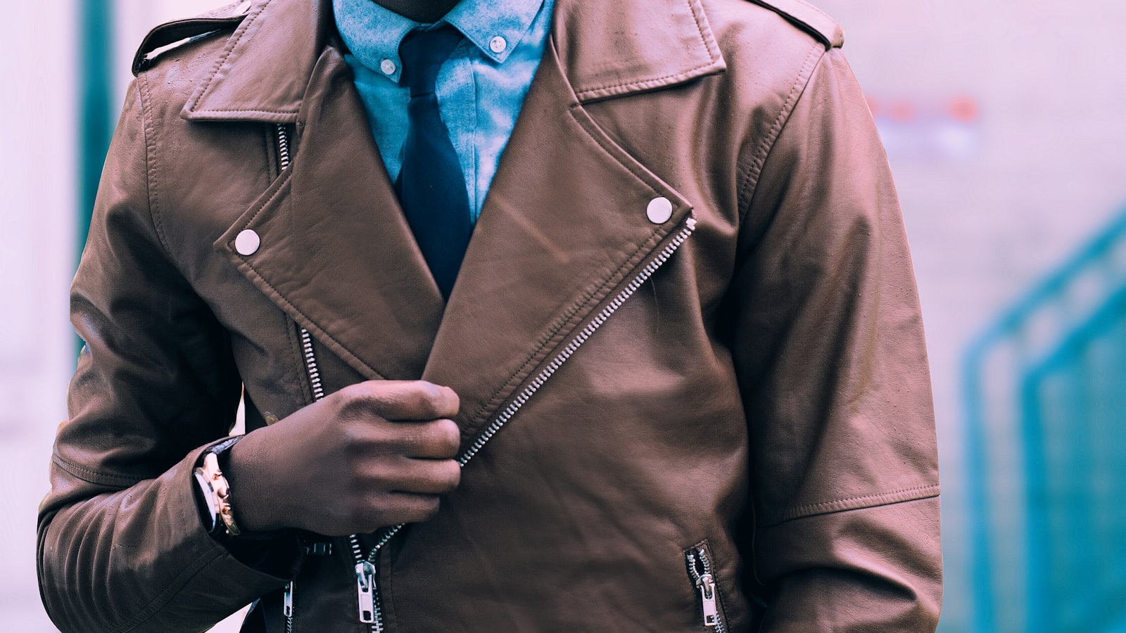 A person choosing clothes from a rail, looking relaxed and comfortable.